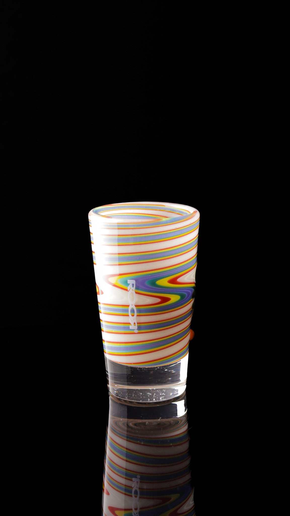 ROOR® Shot Glass with colorful custom design on black background.