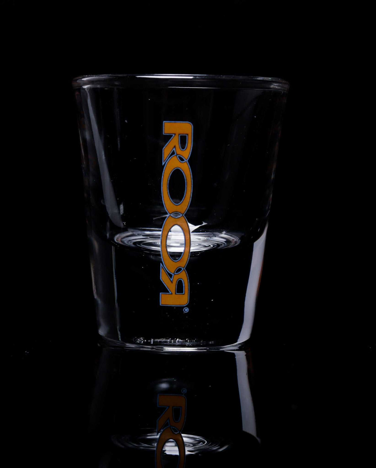 ROOR Shot Glass with thick clear base and assorted decals.