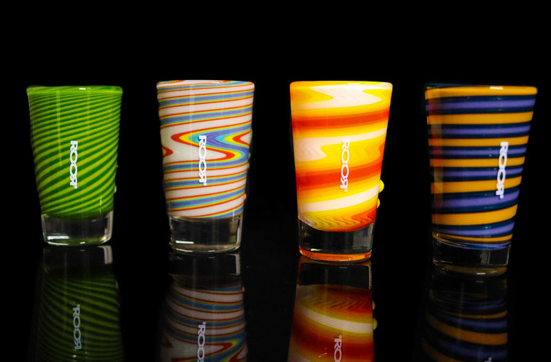 ROOR® Shot Glass Custom Worked with assorted colors and white decal, 2oz size, displayed on a black background.